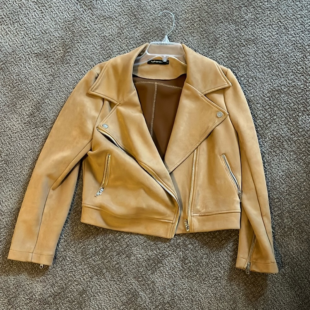 Suede material jacket. Caramel color. Used but great condition
